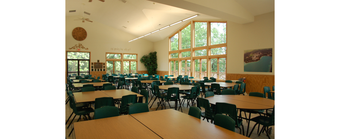 Spencer-Lake-commercial-architect_camp_Dining-Hall-Dining-room-with-tables-2-1100x450.jpg
